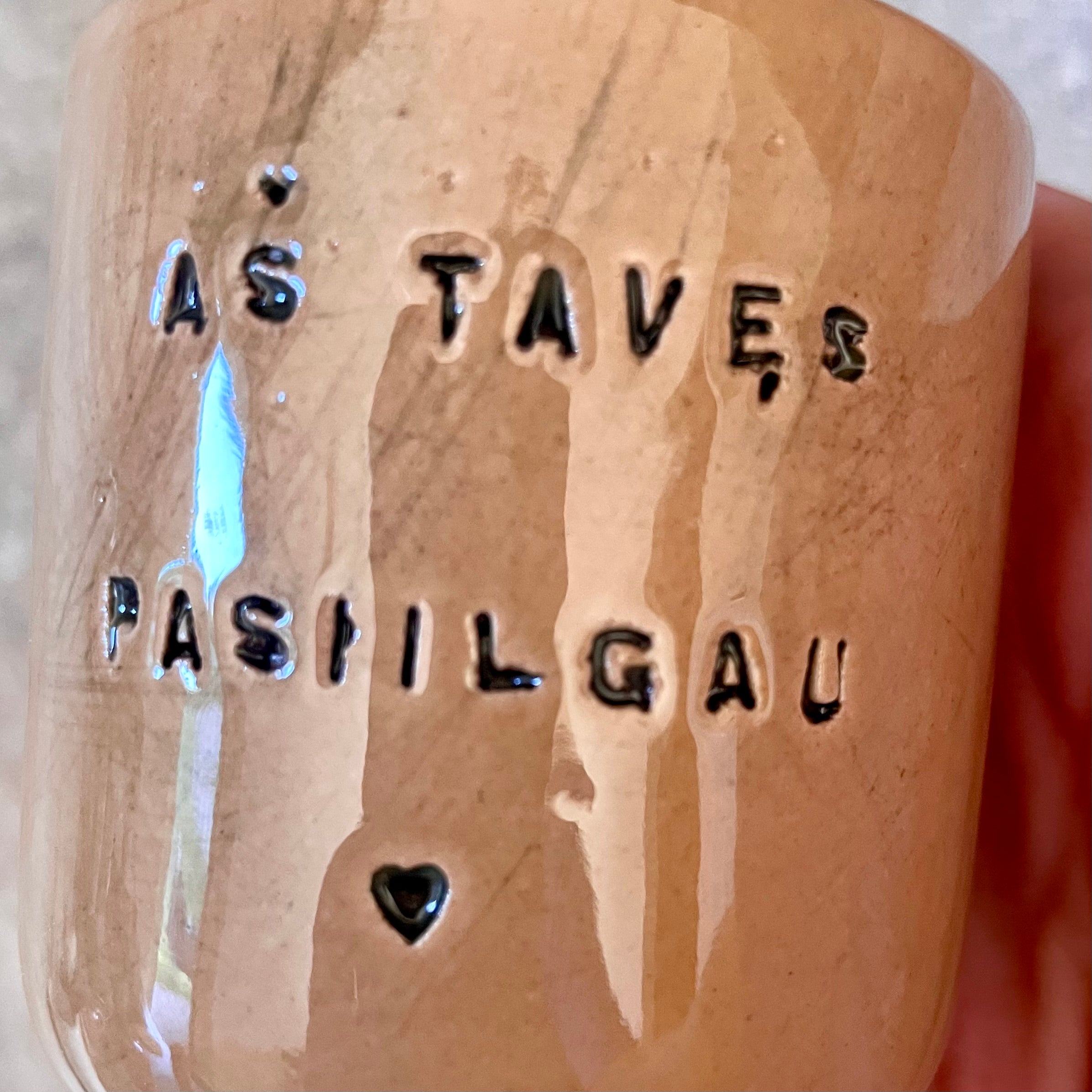 Brownish small mugs without handle with sentimental text