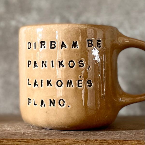 Caramel mug with words about work