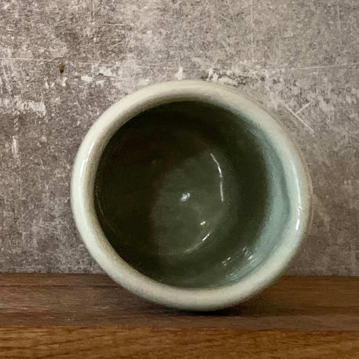 Pale blue mug with saying in Spanish