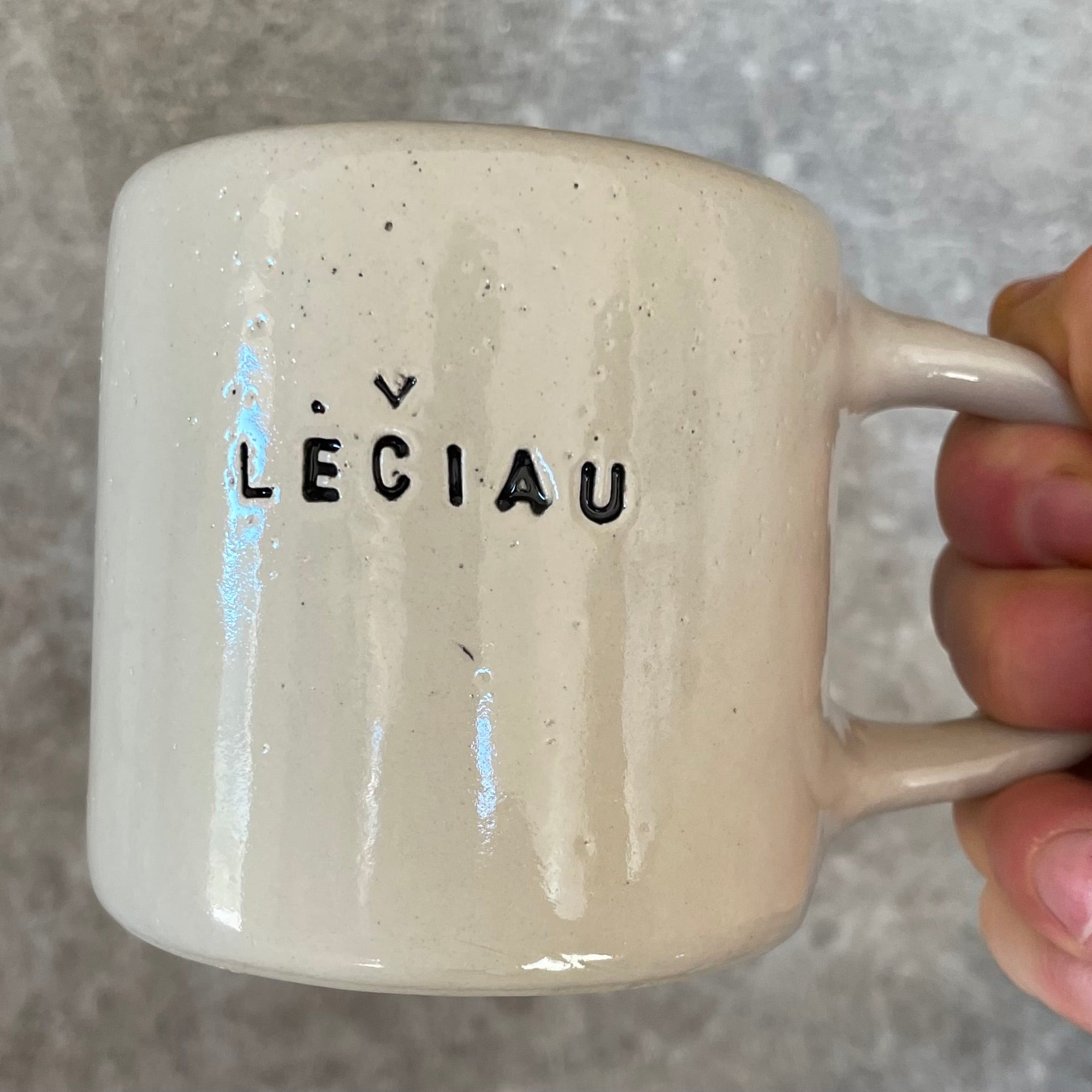 Ceramic mug with word LĖČIAU