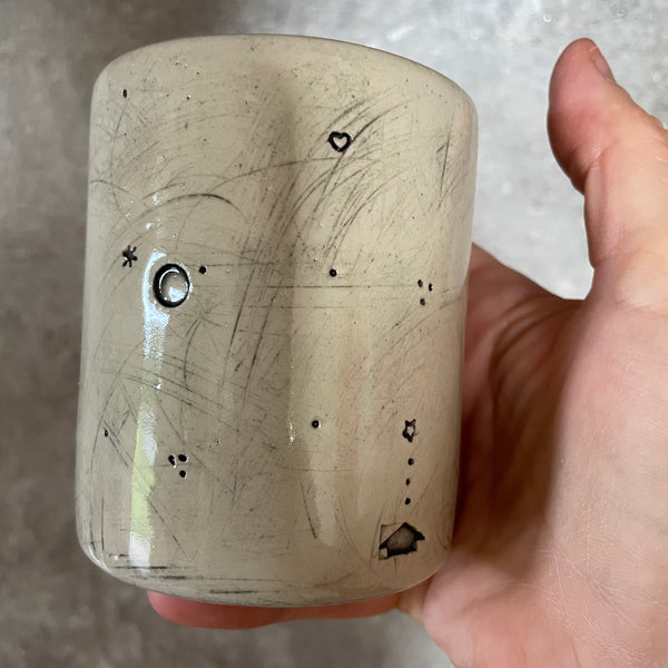 White mug with magic saying