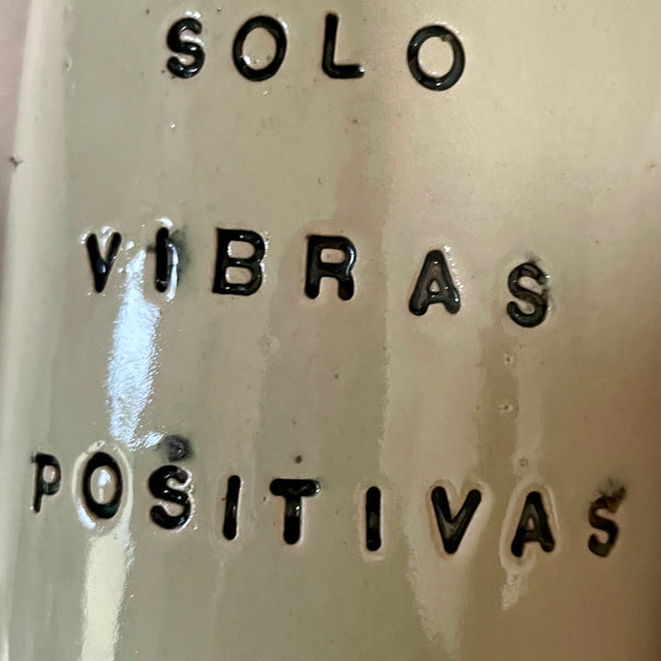 Pale blue mug with saying in Spanish