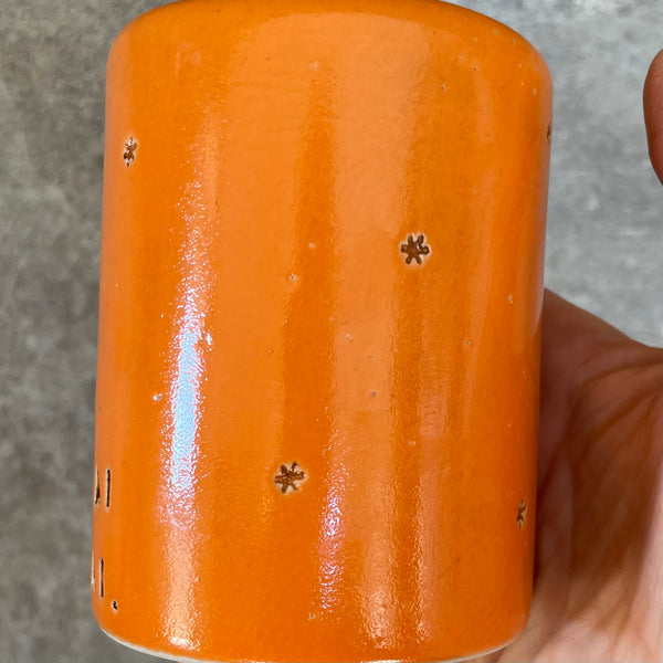 Bright orange mug about wishes