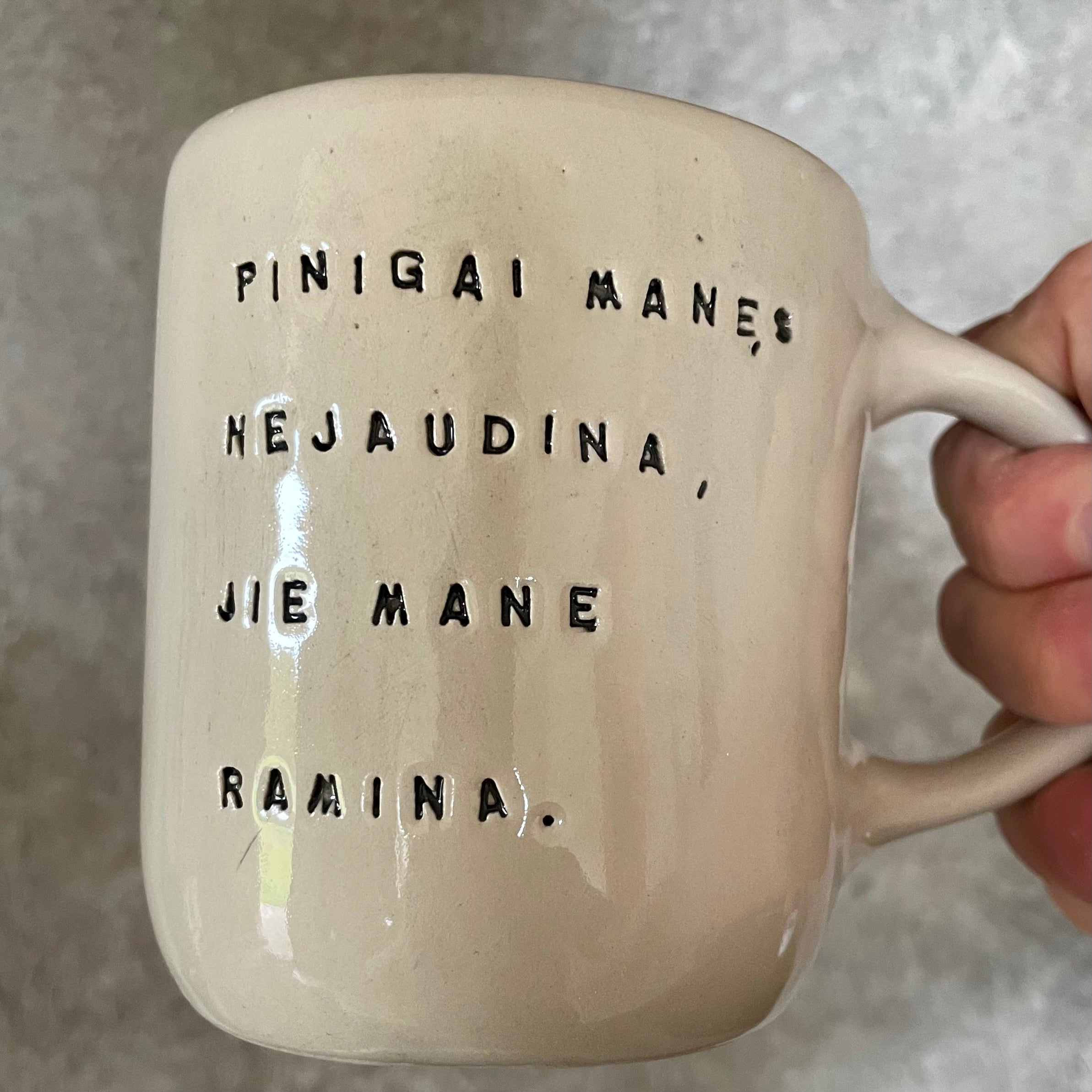 Ceramic mug with money saying