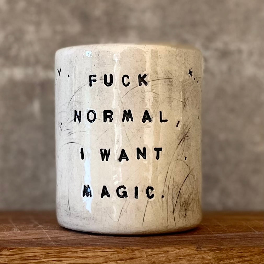 Ceramic tumbler mug with magic saying