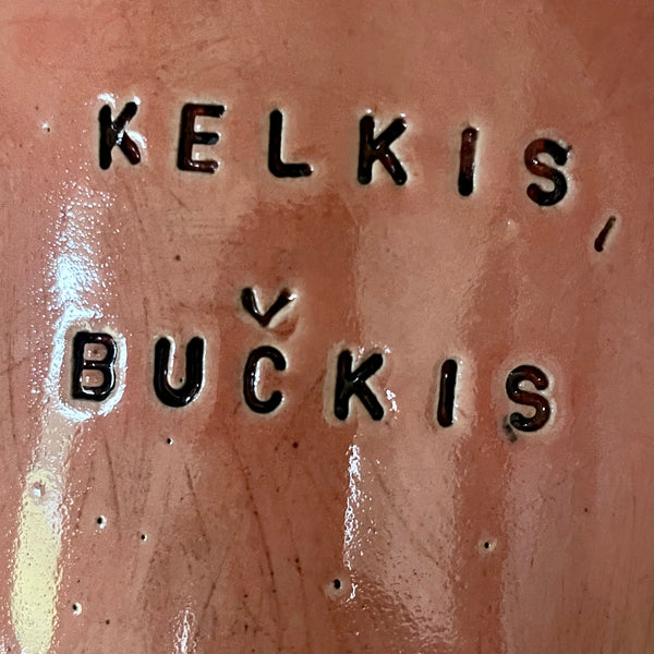 Big red mug with saying in Lithuanian