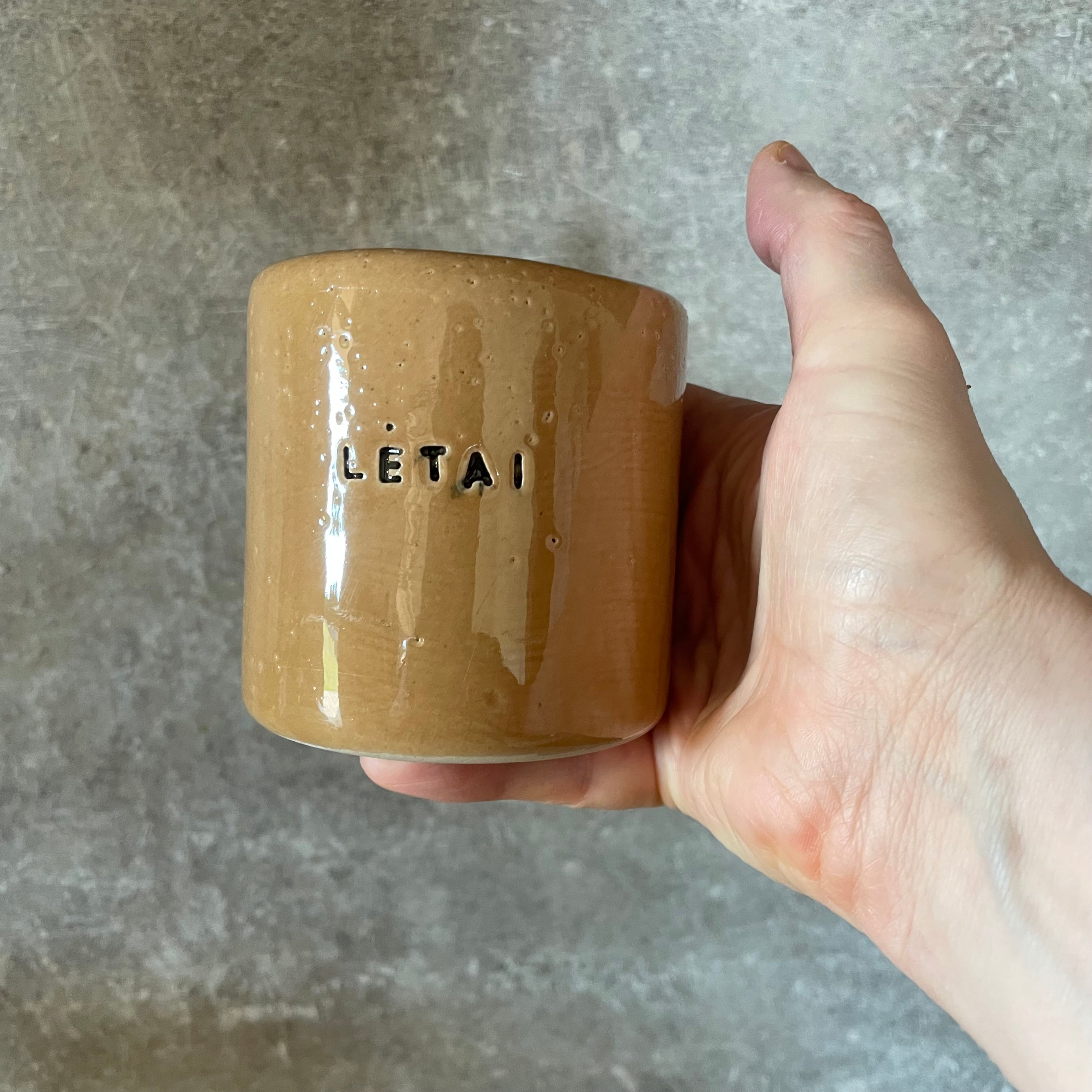 Caramel mug with word LĖTAI
