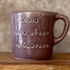 Small purple mug with words in Lithuanian
