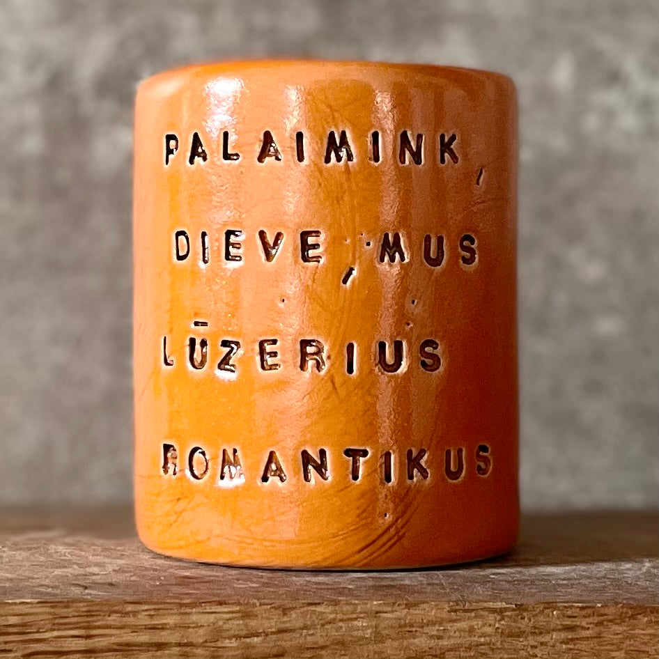 Bright orange mug with blessing