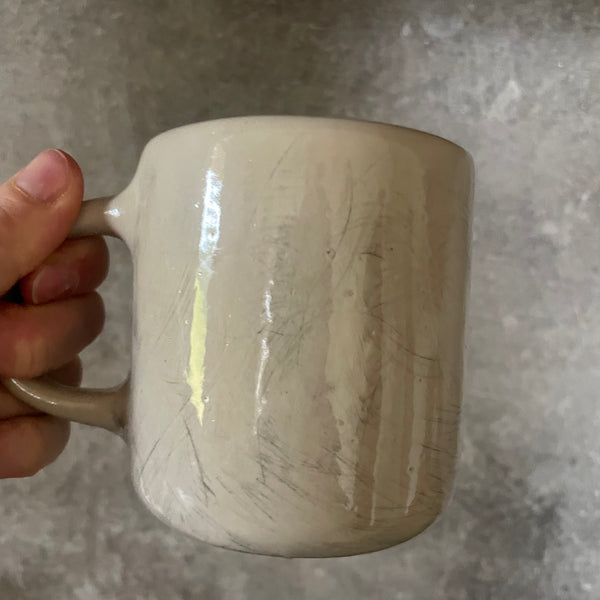 White medium ceramic mug with words about work