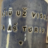 Blue mug with words in Lithuanian