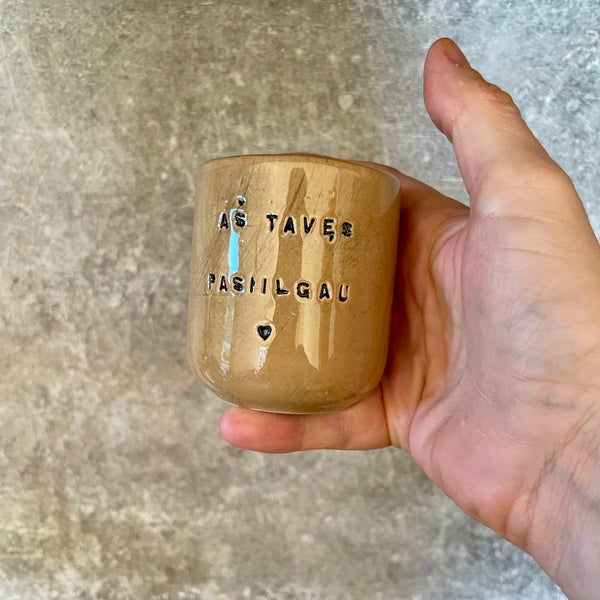Brownish small mugs without handle with sentimental text