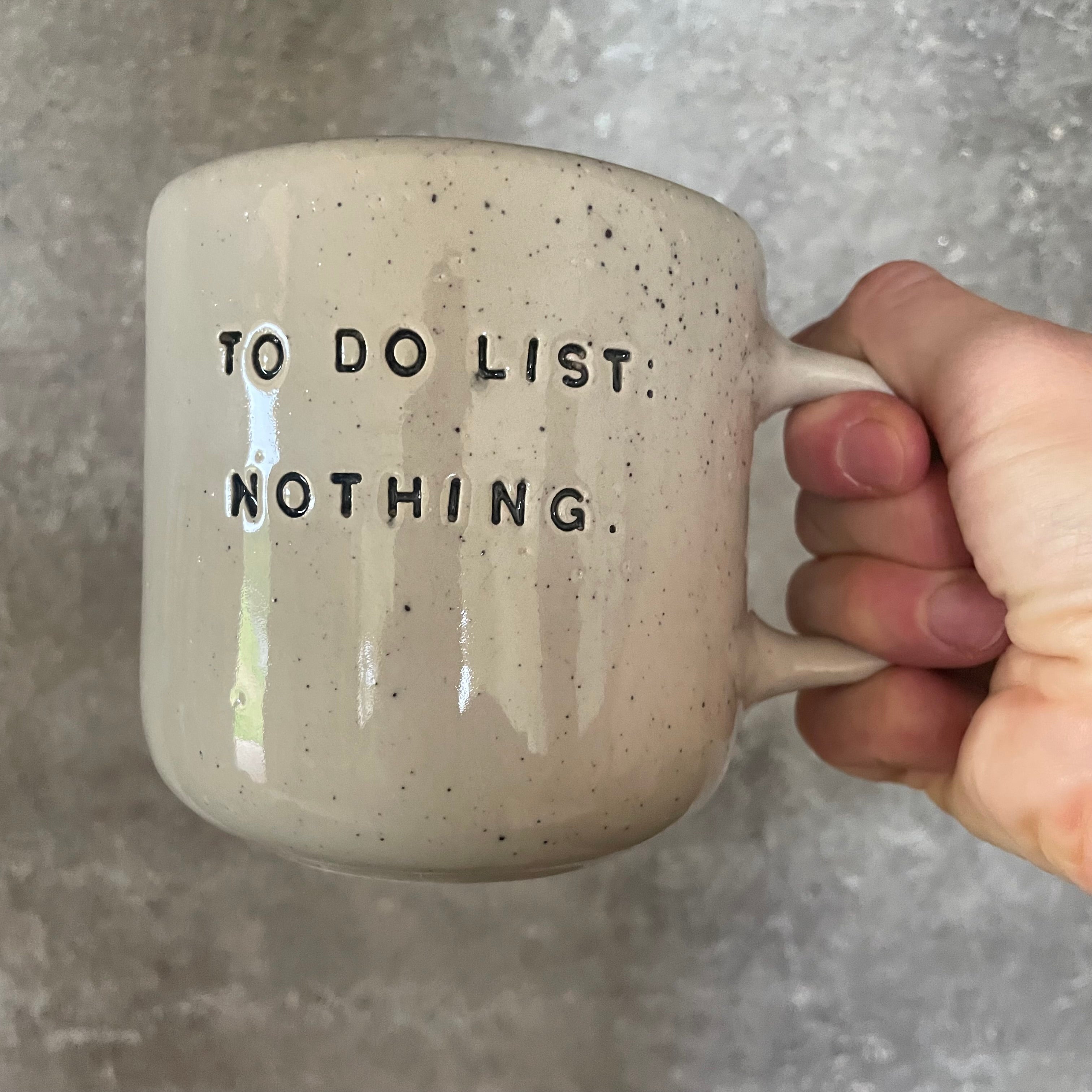 Speckled mug with cozy saying