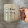 Speckled mug with cozy saying