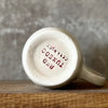 Speckled mug with saying in Lithuanian