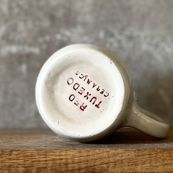 Speckled mug with saying in Lithuanian