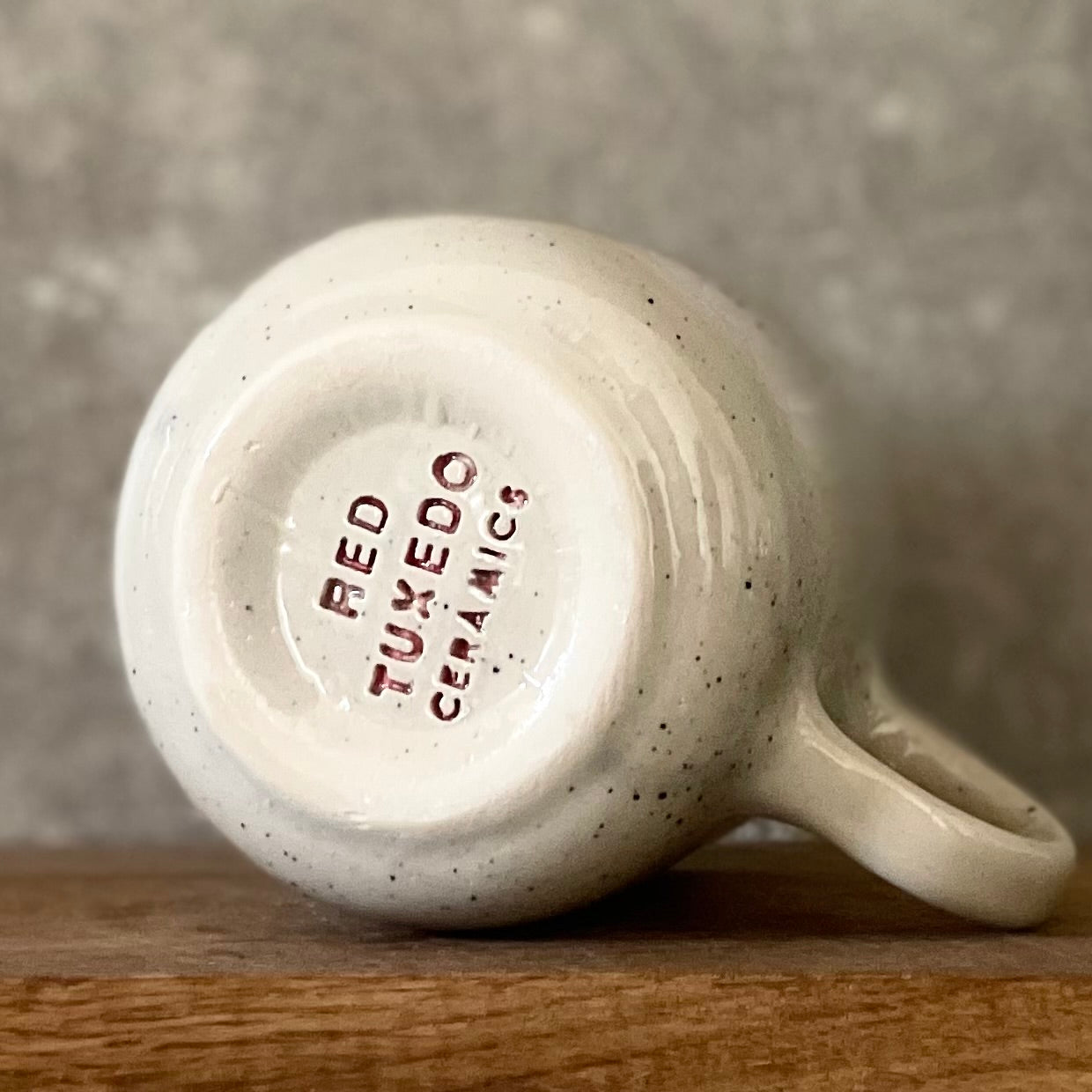 Speckled mug with cozy saying