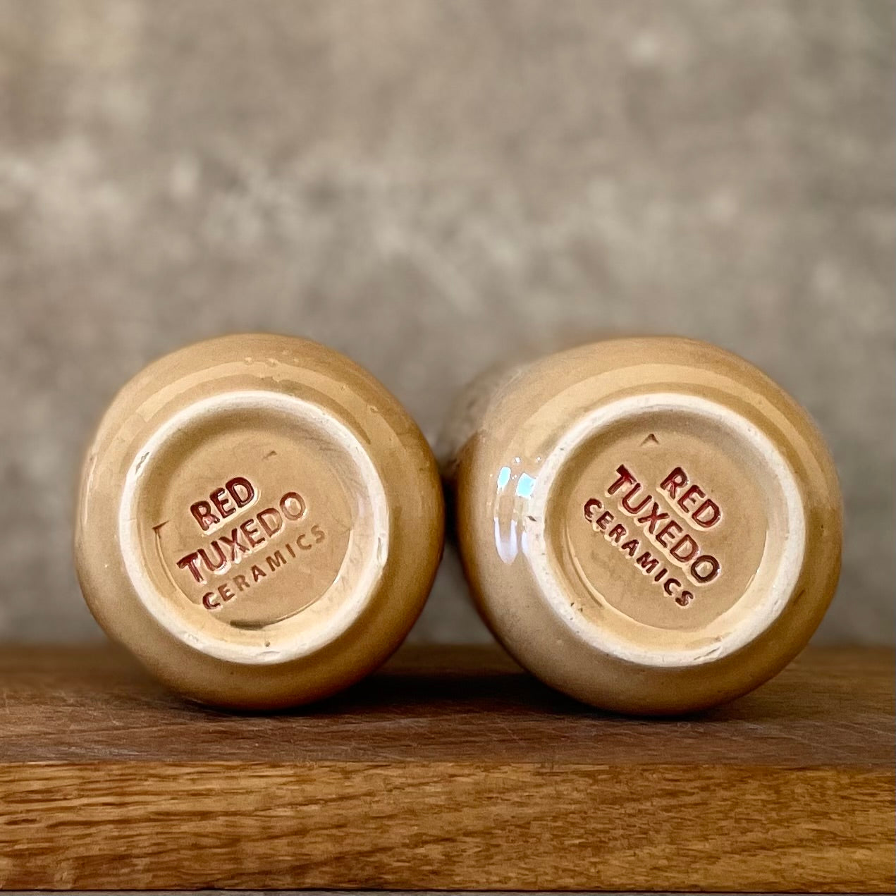 Brownish small mugs without handle with sentimental text