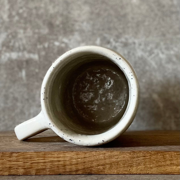 Speckled mug with saying in Lithuanian
