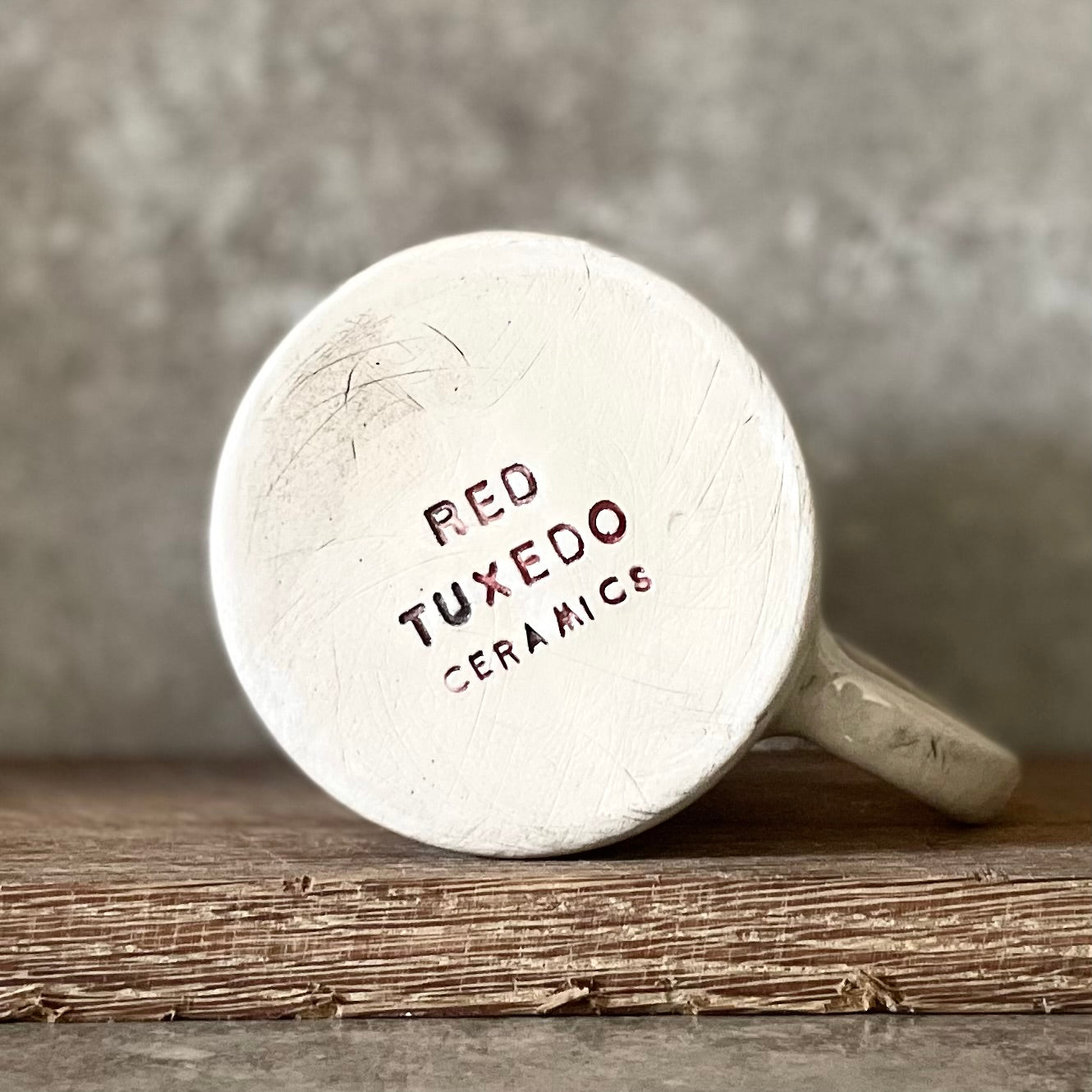 White ceramic mug with words about work