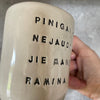 Ceramic mug with funny saying about money