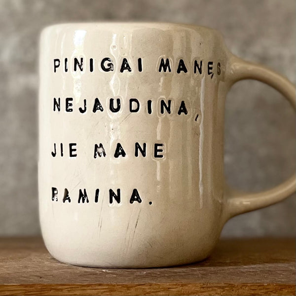 Ceramic mug with funny saying about money