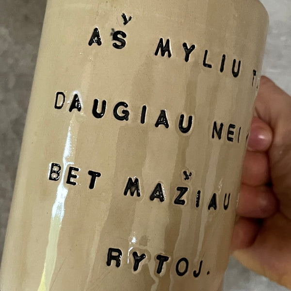 Beige mug with love saying in Lithuanian