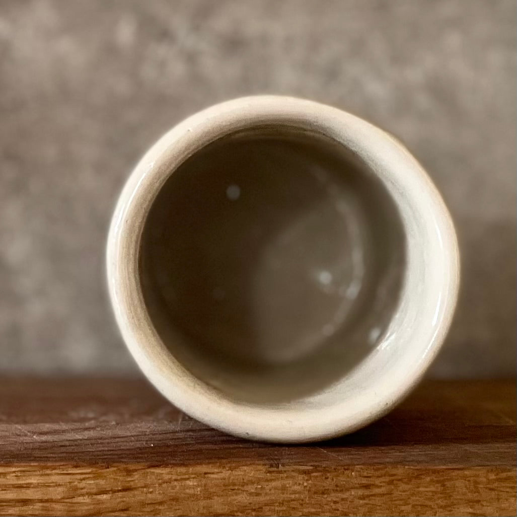 White mug with magic saying