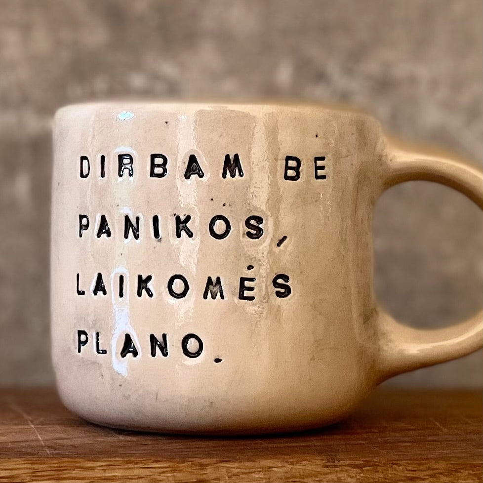Ceramic mug with words about work