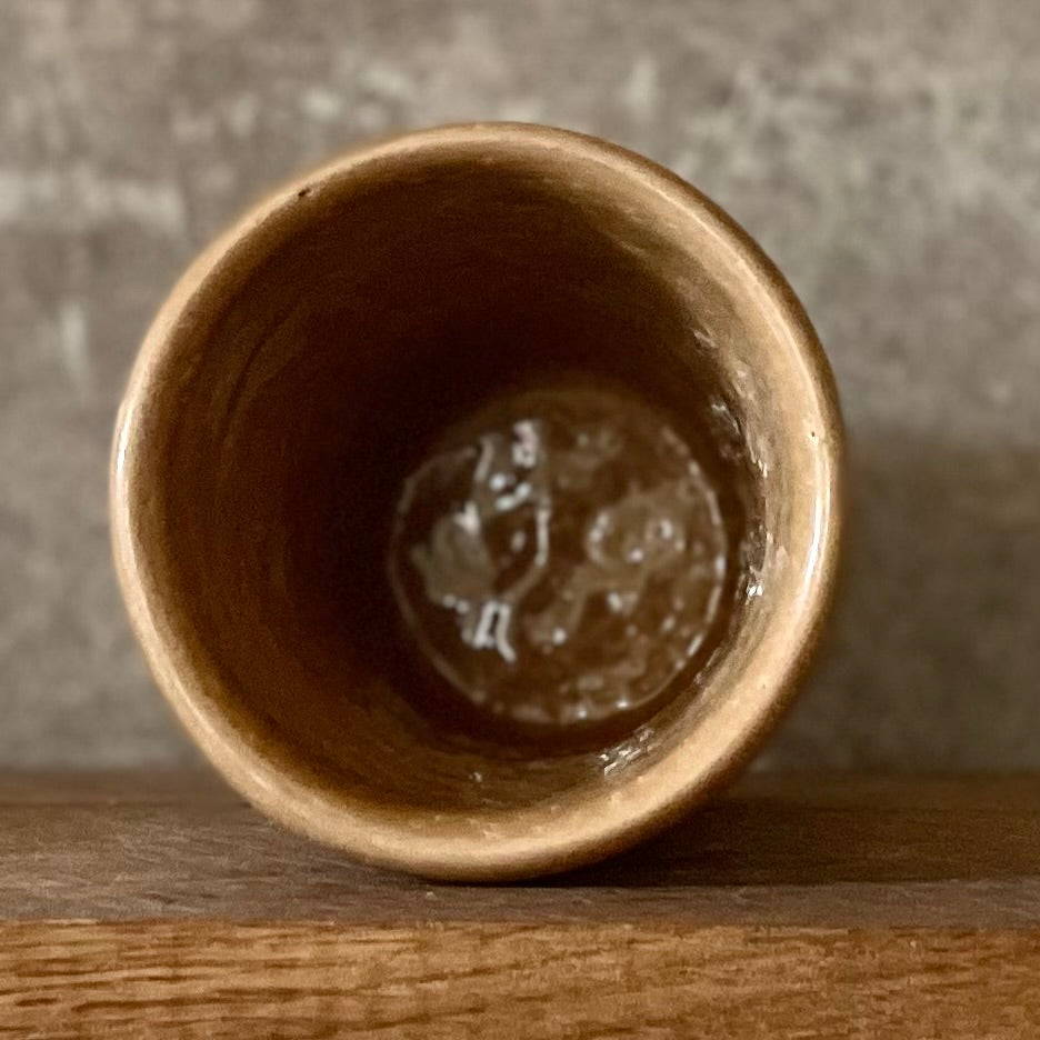 Caramel brown mug with phrase