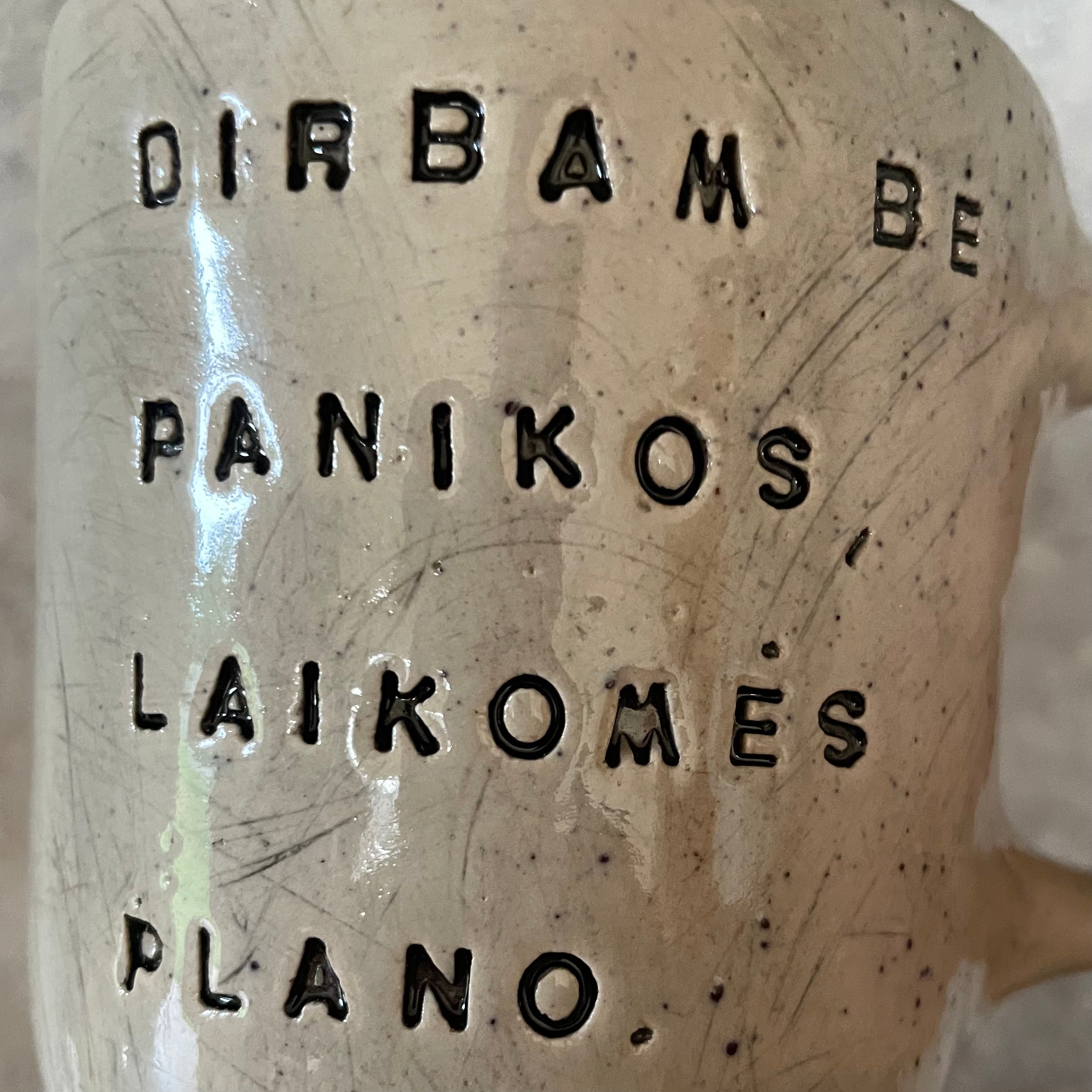 Speckled mug with words about work
