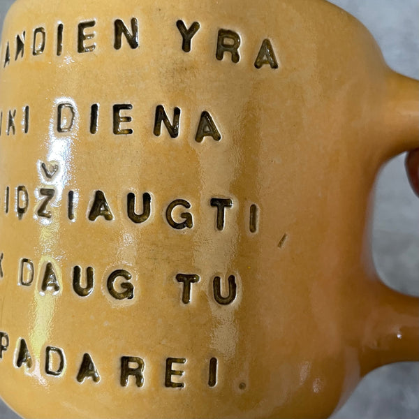 Yellow mug with optimistic text