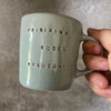 Blue mug with saying in Lithuanian