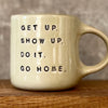 Beige mug with quote