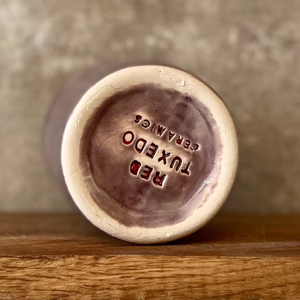 Purple mug with saying in Lithuanian