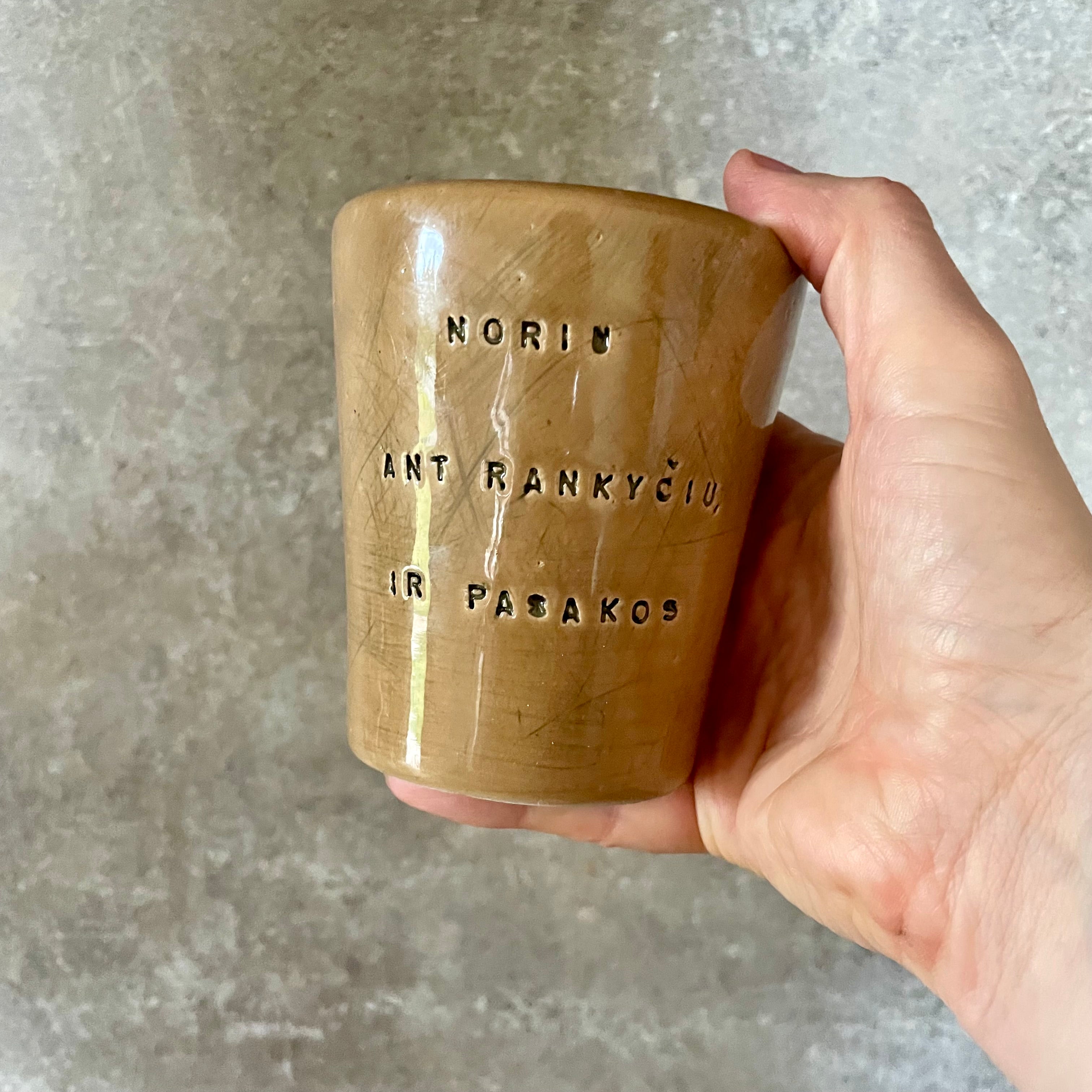 Caramel brown mug with phrase