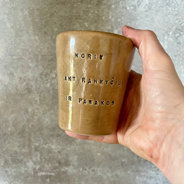 Caramel brown mug with phrase