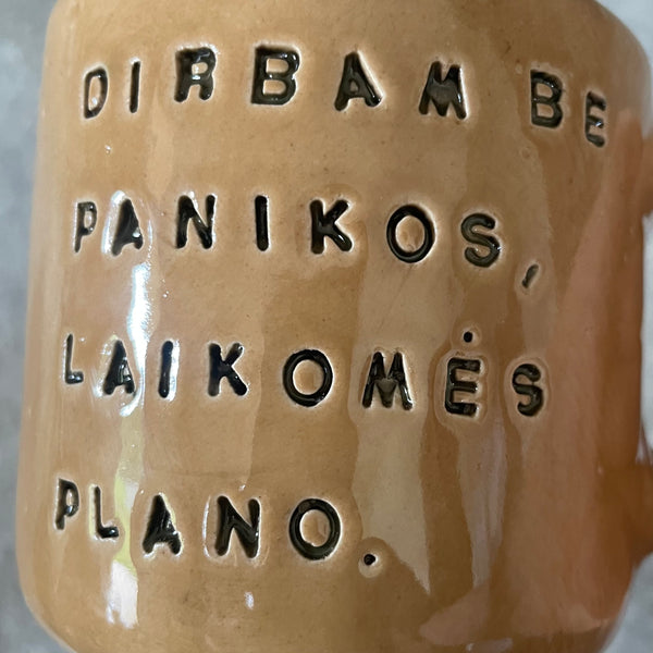 Caramel mug with words about work
