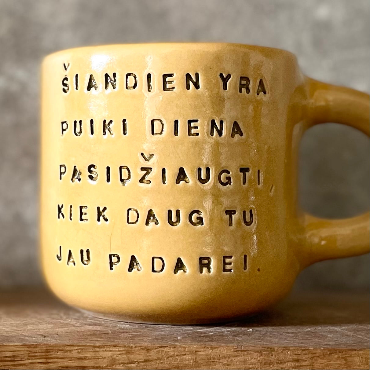 Yellow mug with optimistic text