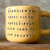 Yellow mug with optimistic text