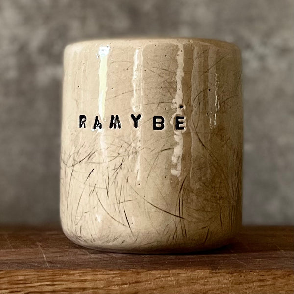 Beige tumbler mug with word RAMYBE