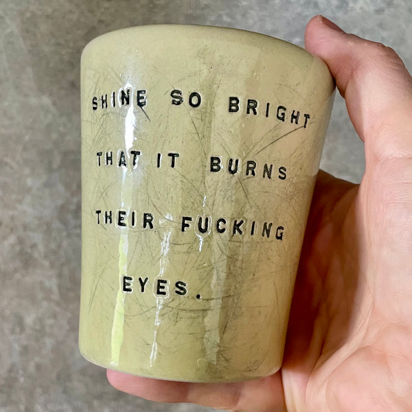 Bright yellow mug with saying