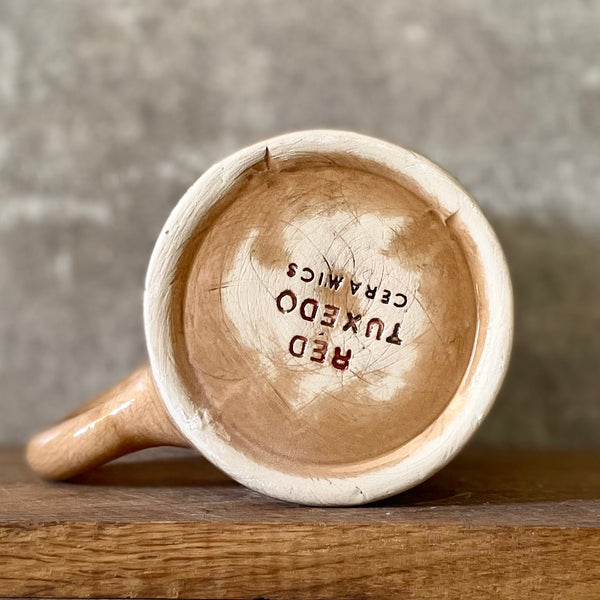 Brown mug with saying about coffee