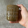 Brown small mug with phrase