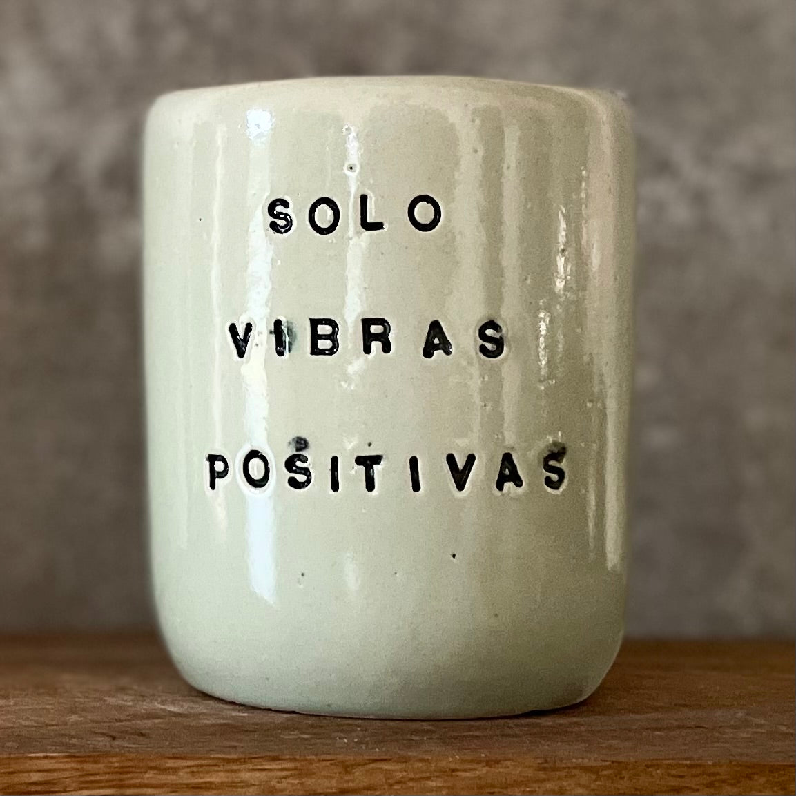 Pale blue mug with saying in Spanish