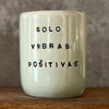 Pale blue mug with saying in Spanish