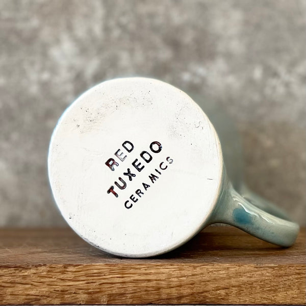 Blue mug with quote about goals