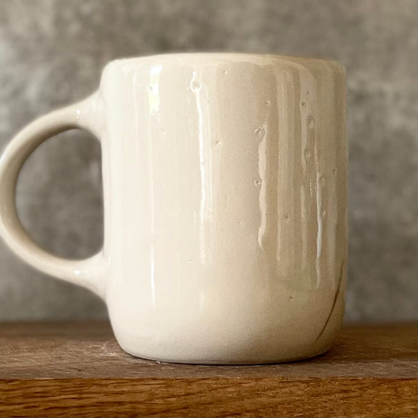 Ceramic mug with money saying