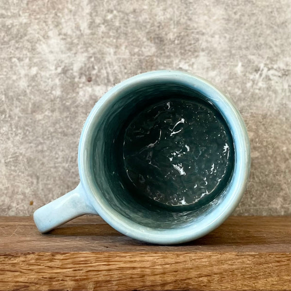 Blue mug with quote about goals