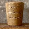 Caramel brown mug with phrase